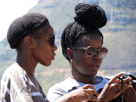 Kaapstad - selfie in de wachtrij weerspiegeld in de bril